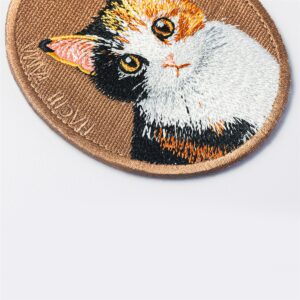 Double-sided calico cat embroidered pet charm keyring by HACHI TAMA, featuring a cat portrait with white, orange and black fur