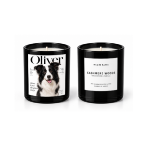 HACHI TAMA Cashmere Woods candle in a black glass jar with a white front label