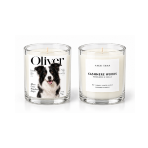 HACHI TAMA Cashmere Woods candle in a clear glass jar with a white front label