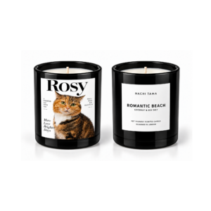 HACHI TAMA Romantic Beach candle in a black glass jar with a white front label