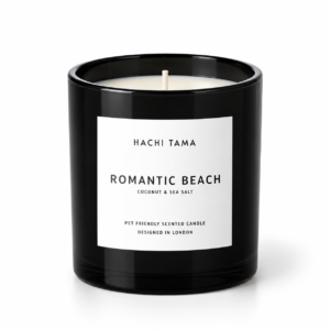 HACHI TAMA Romantic Beach candle in a black glass jar with a white front label