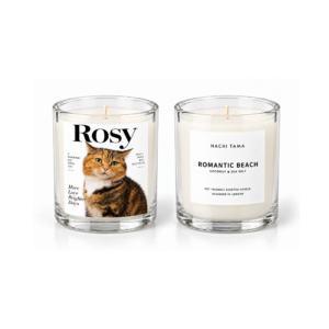 HACHI TAMA Romantic Beach candle in a clear glass jar with a white front label