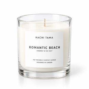 HACHI TAMA Romantic Beach candle in a clear glass jar with a white front label