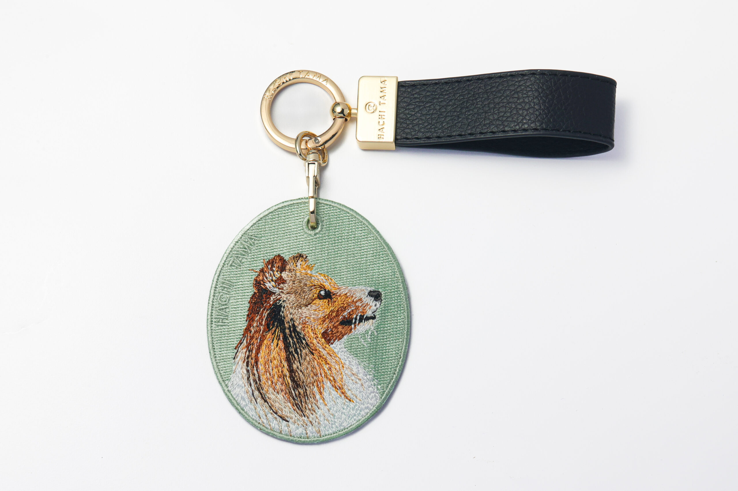 Rough Collie embroidered pet charm by HACHI TAMA with a leather strap