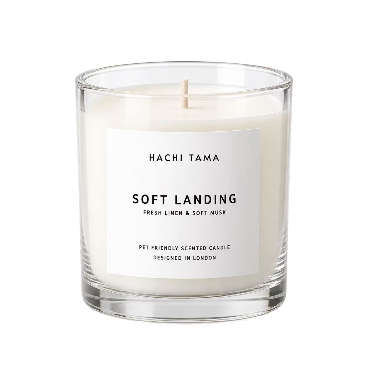 HACHI TAMA Soft Landing candle in a clear glass jar with a white front label