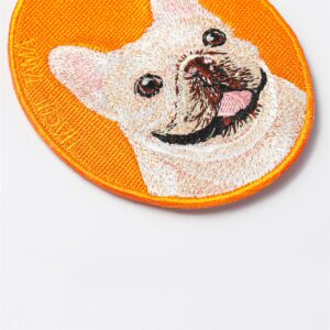 Close-up of the white French Bulldog pet charm by HACHI TAMA, showing detailed embroidery